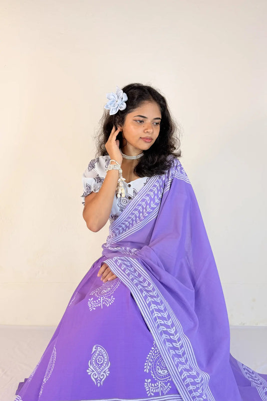 Woman wearing a purple Gopi Skirt Set with white patterns against a plain background