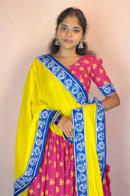 Mid-length shot of Rasika Rangini Gopi dress highlighting hand block printed blouse, yellow dupatta and blue border