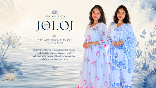 Two women modeling light blue traditional garments with floral and geometric patterns, set against a soft watercolor background with the brand name JOLOJ and collection text.