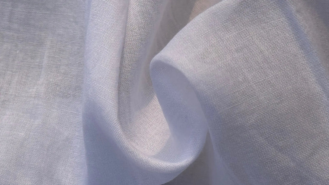 Close-up view of pure cotton fabric showing matte texture, natural weave, and breathable structure