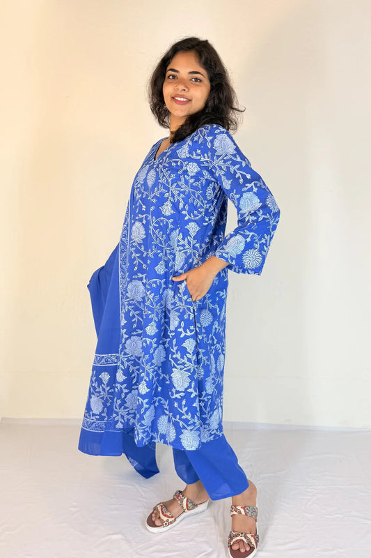 Woman wearing a blue floral kurta with white background