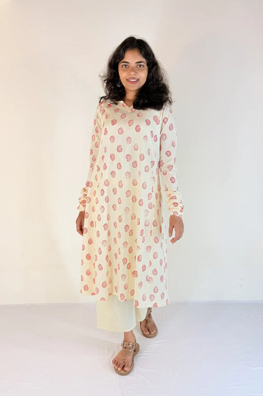 Woman wearing a floral dress against a white background