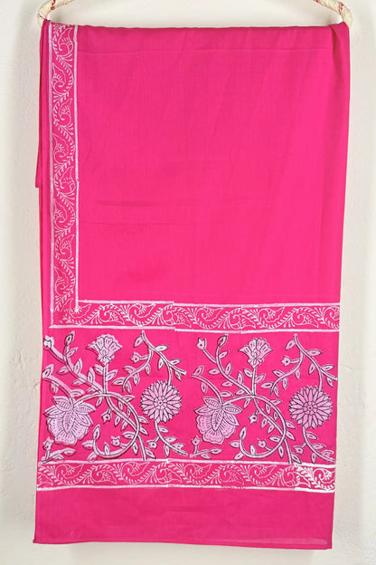 Pink fabric with white floral patterns on a white background