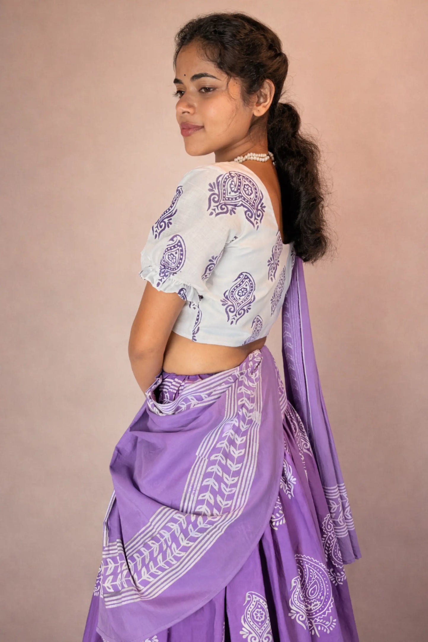Back and side angle of Anuragini hand block print pure cotton Gopi skirt set showing blouse fit and skirt volume