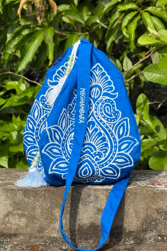 Indigo blue handcrafted japa mala bag with intricate white block printed design and drawstring closure, eco-friendly spiritual accessory