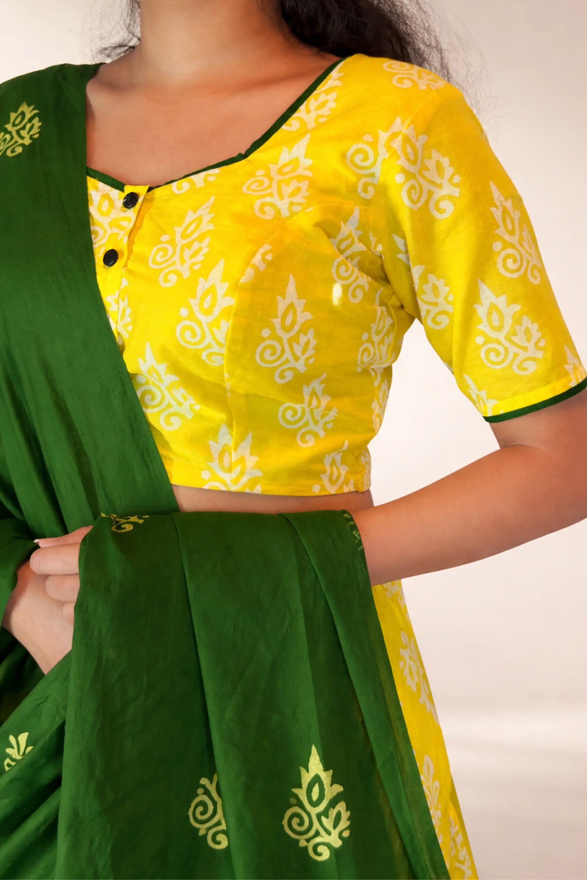 Close-up of blouse and neckline detail in Basantika yellow hand block print pure cotton gopi skirt set