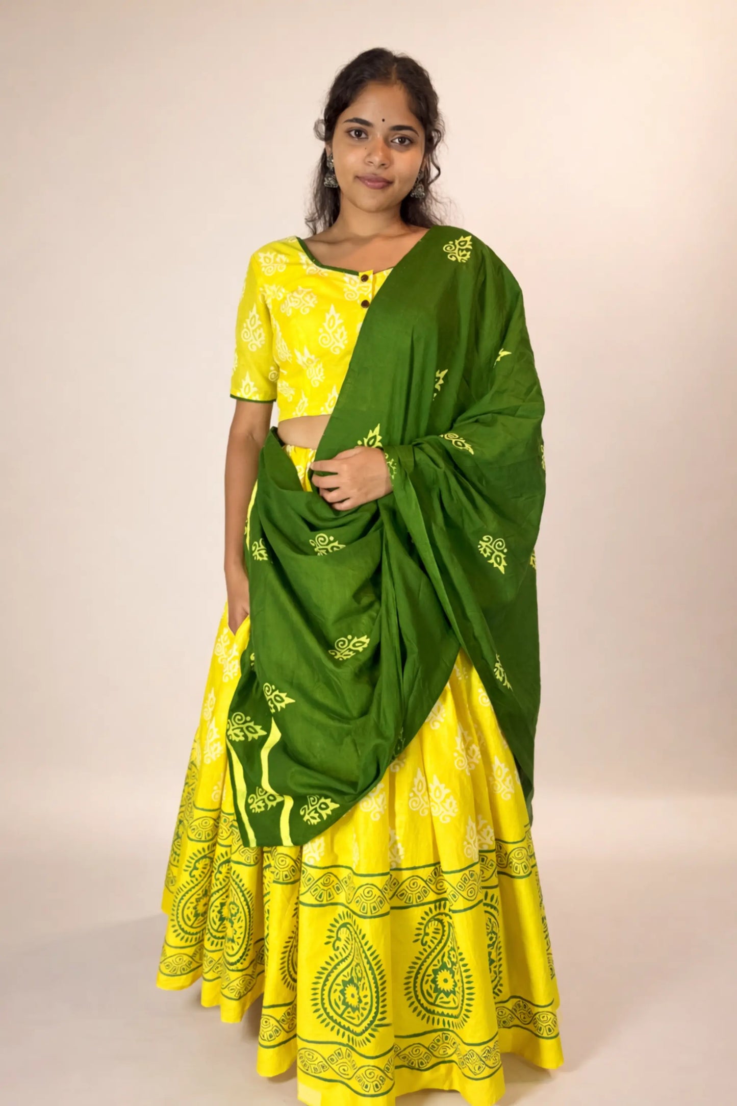 Front pose of Basantika yellow and green hand block print pure cotton gopi skirt set