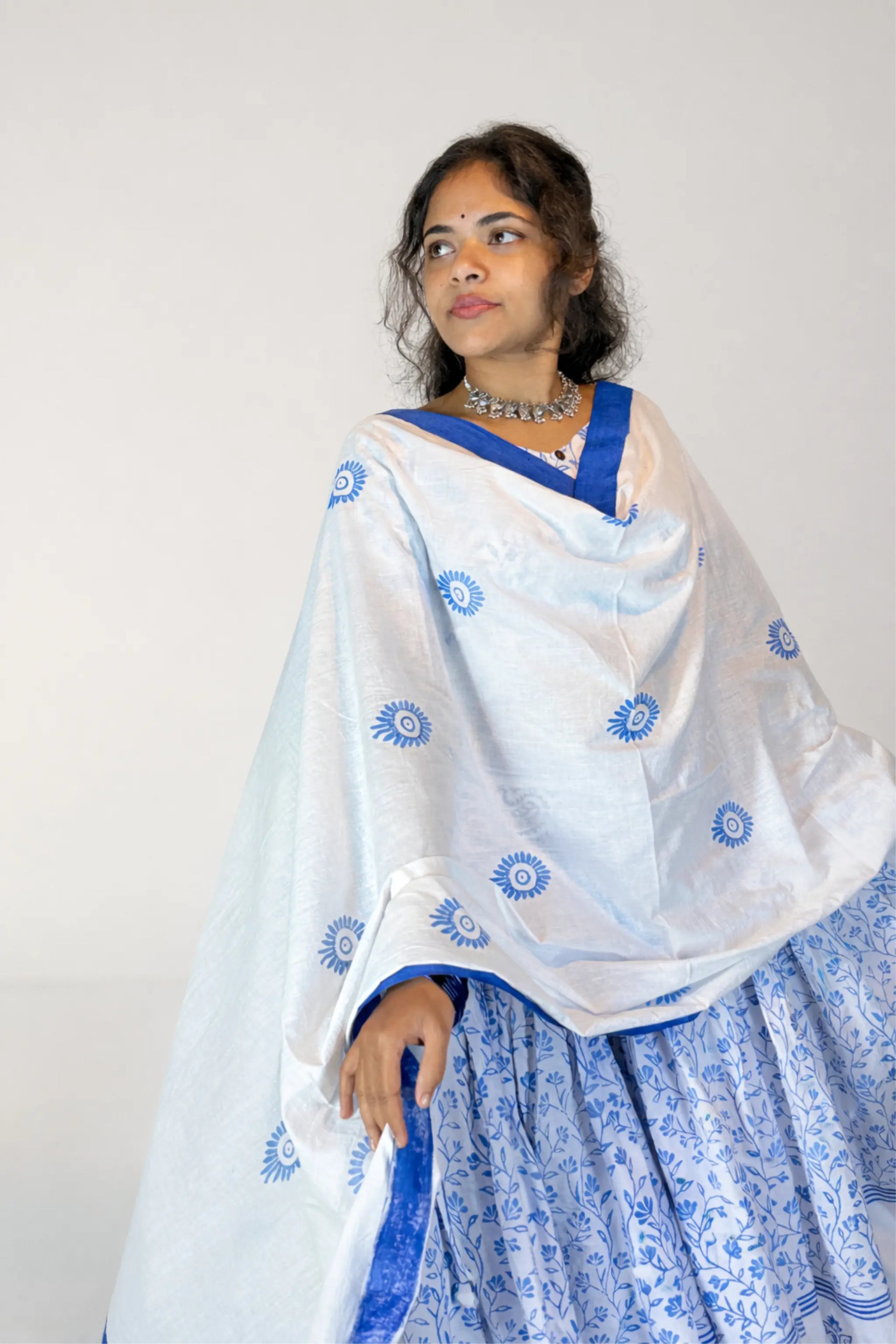 Neckline and hand block print details of the blue and white Charubala cotton gopi dress