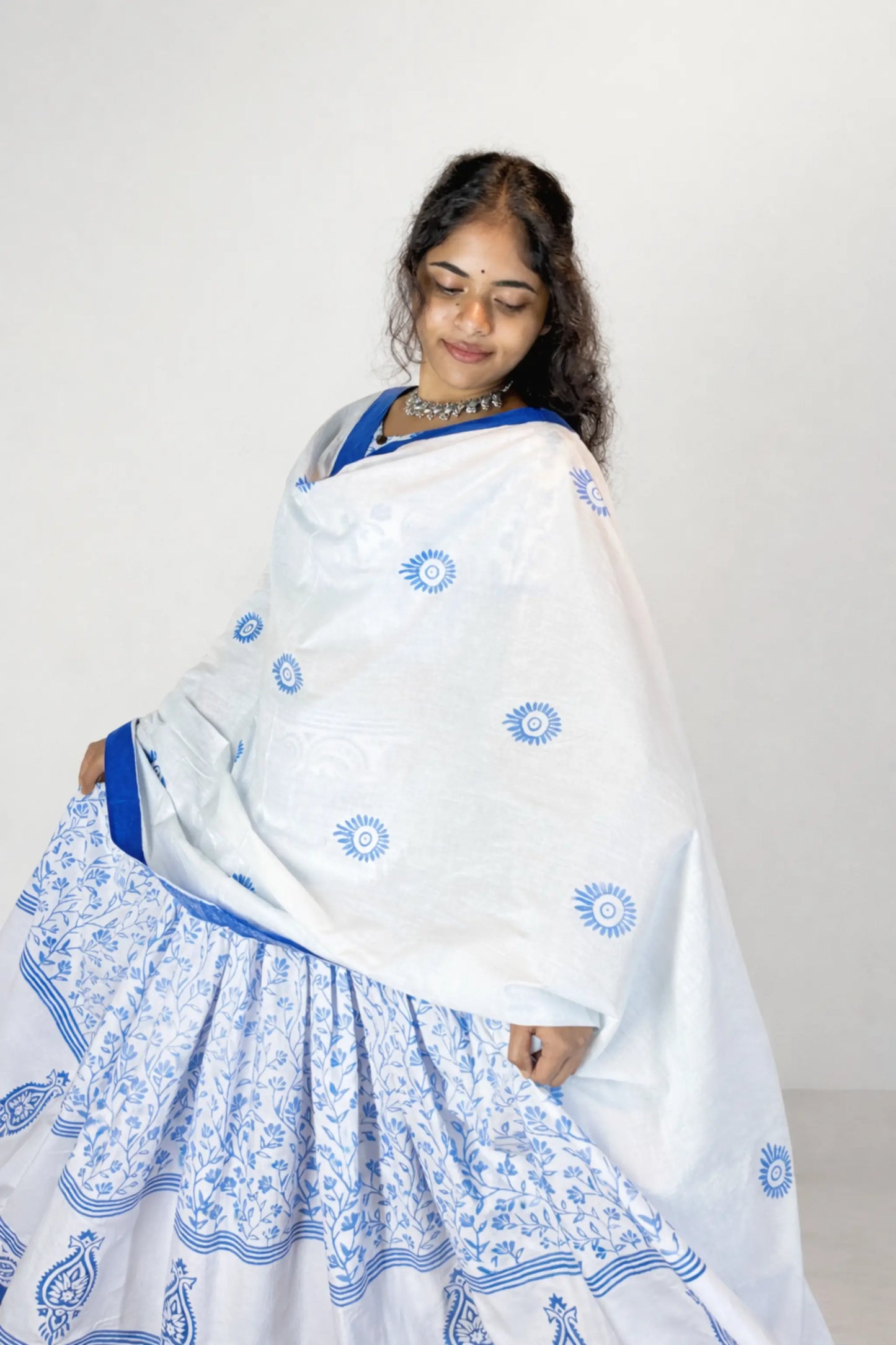 Blue and white block print Charubala cotton gopi dress with contrast blue border under soft studio lighting