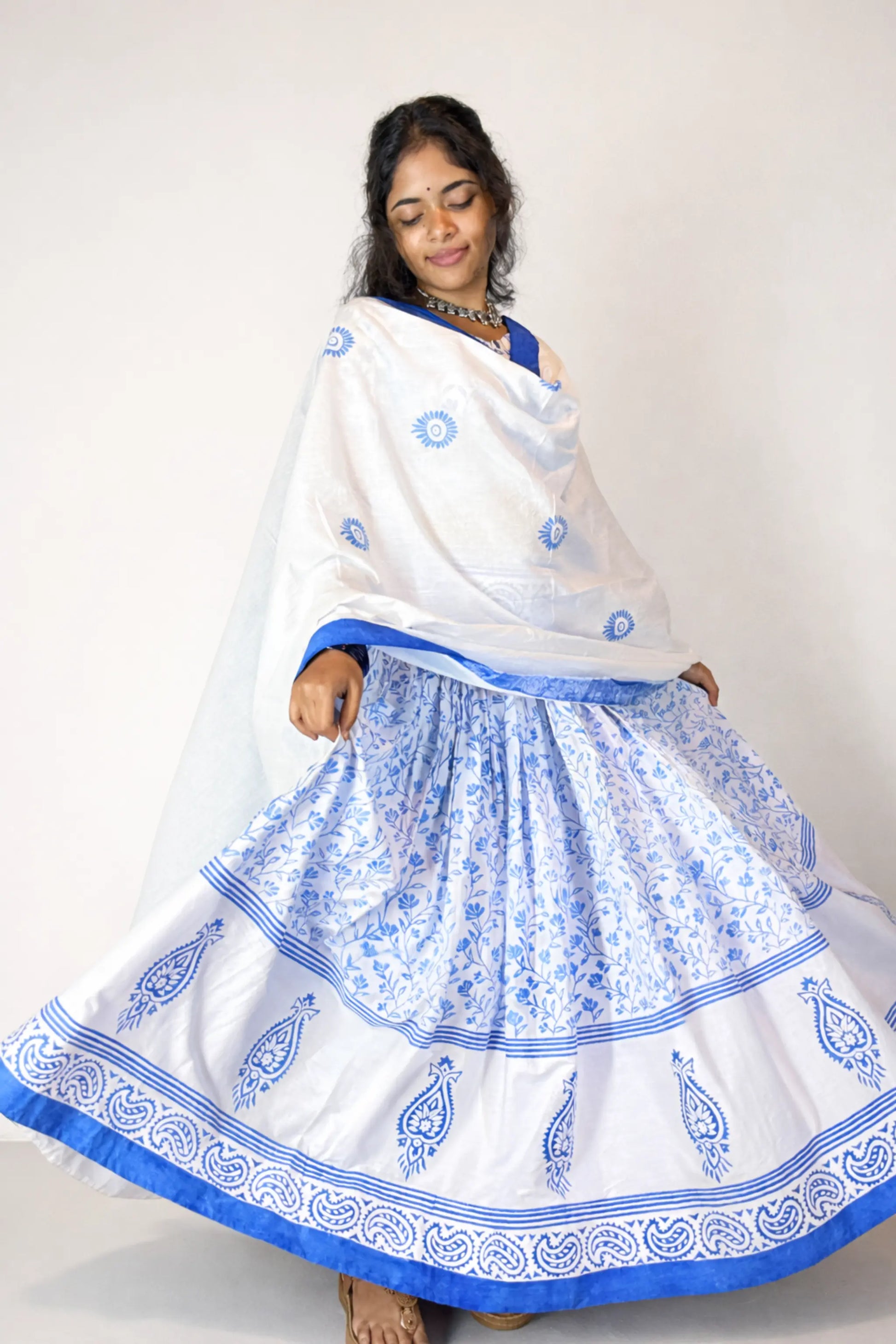Complete outfit view showcasing the flared skirt and block print border of the Charubala cotton gopi dress