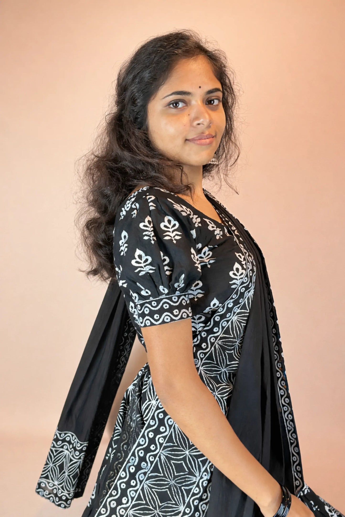 Side view of Kalindi handcrafted black and white block print cotton gopi dress with flowing dupatta and elegant silhouette