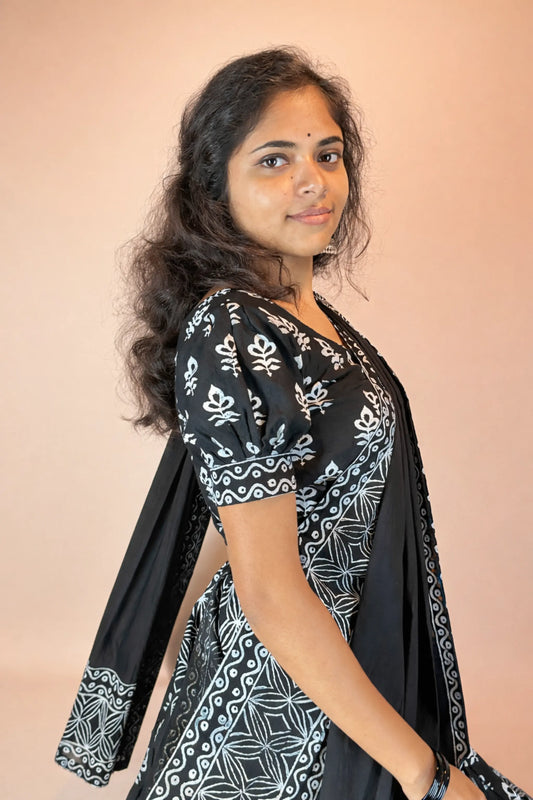 Side view of Kalindi handcrafted black and white block print cotton gopi dress with flowing dupatta and elegant silhouette