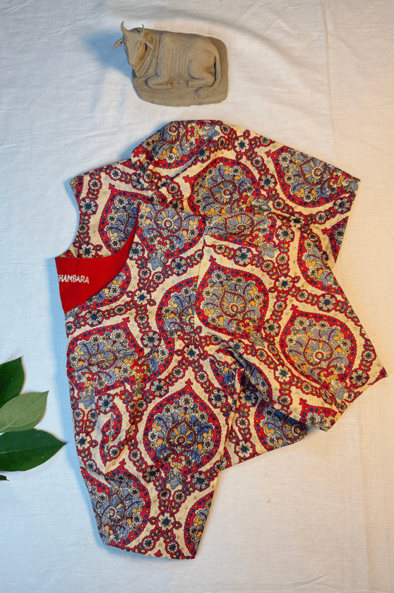 Handcrafted cotton blouse with red and blue paisley block print on cream base, flat lay style, Meghambara