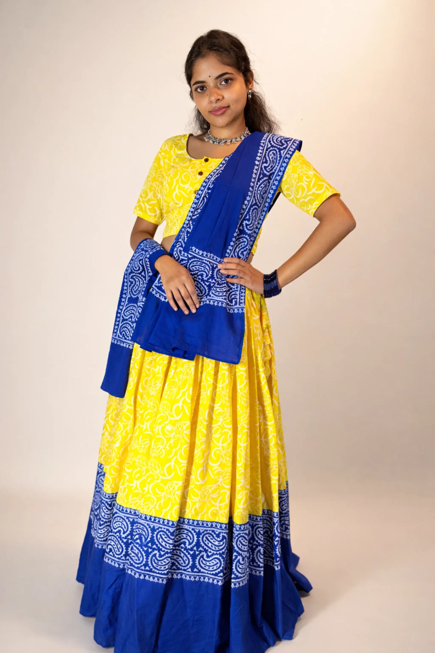 Front pose of Neelambari yellow and blue hand block print pure cotton gopi skirt set with dupatta
