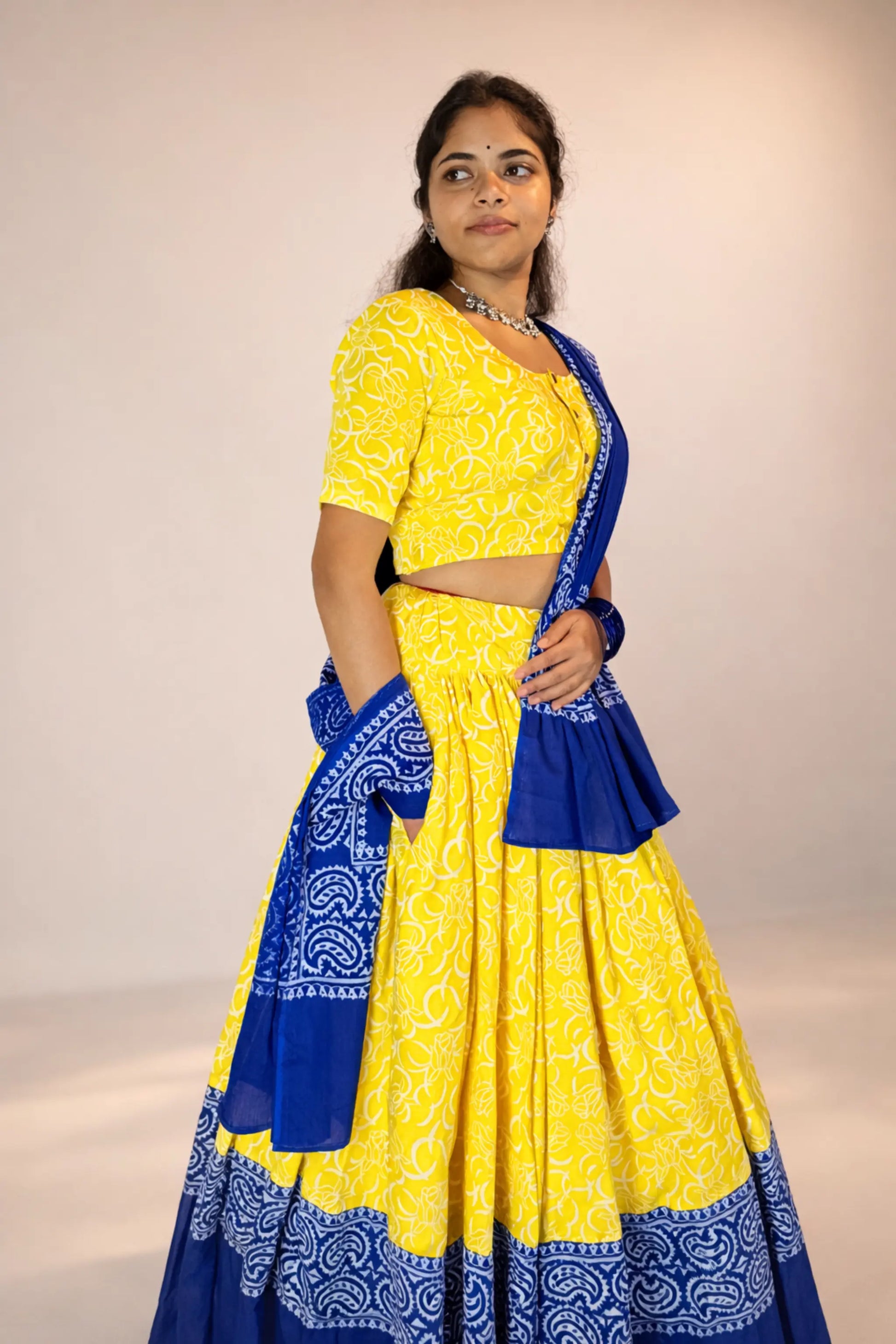 Side view of Neelambari yellow hand block print pure cotton gopi skirt set