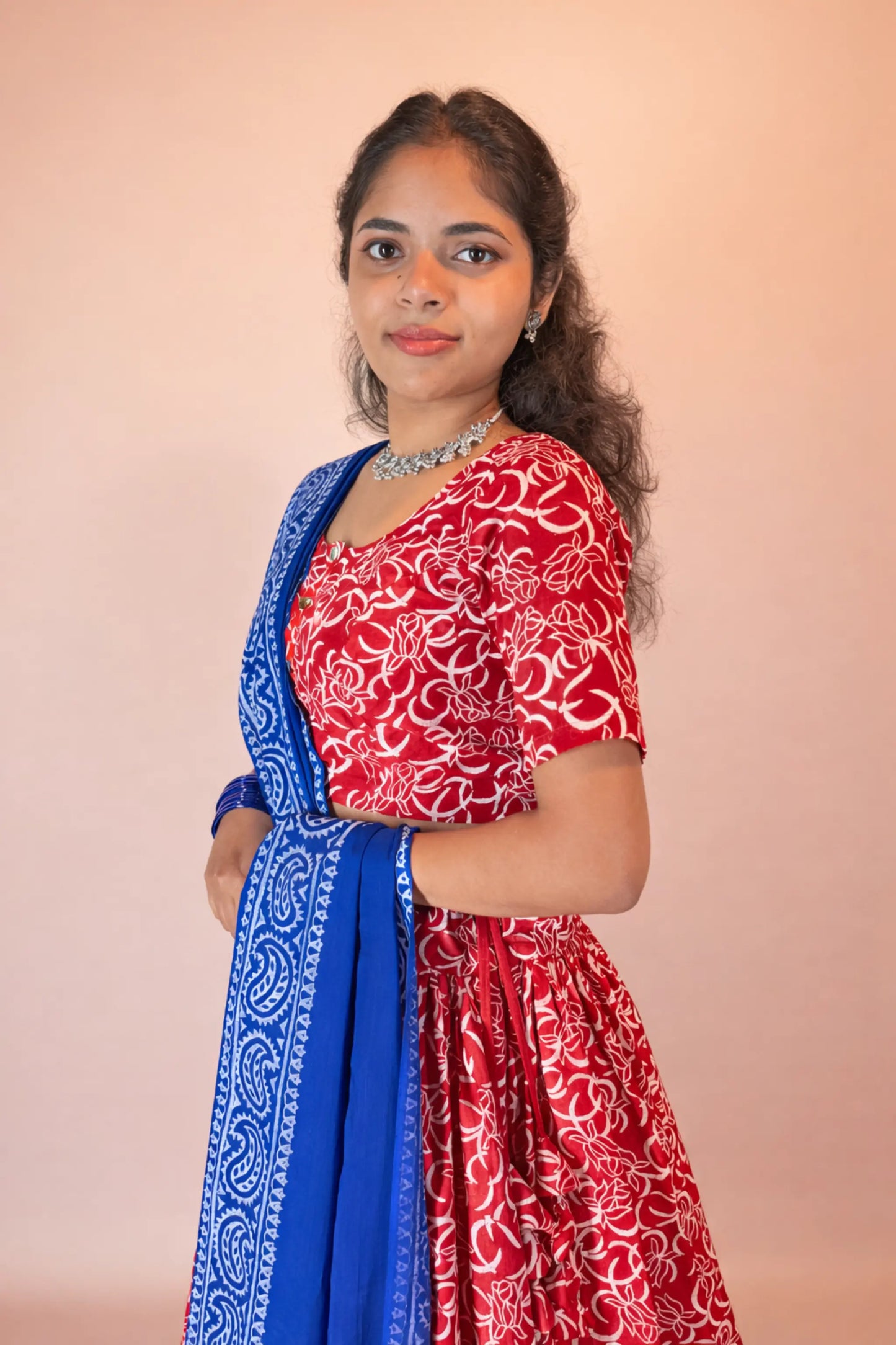 Side view of Ranga Moti red and blue hand block print pure cotton gopi dress highlighting blouse fit and dupatta drape