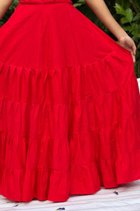 Front view of red cotton petticoat underskirt worn by model, displaying full circular flare and comfortable fit