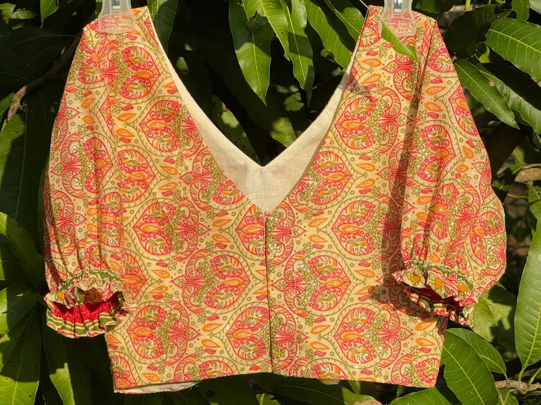 Back view of Meghambara Surangini hand-printed cotton blouse showing puff sleeves and traditional design