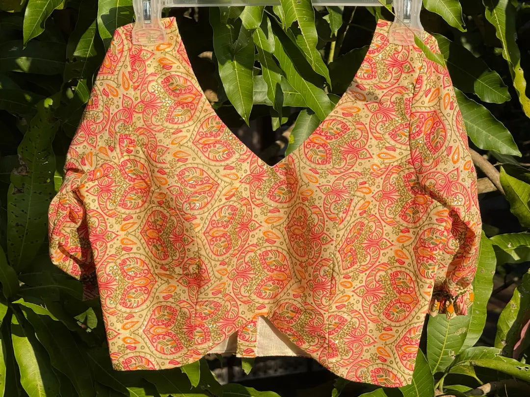 Front view of Meghambara Surangini cotton blouse featuring V-neck design and handcrafted folk paisley print